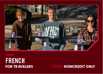 Three students holding trays outdoors