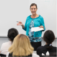 Instructor speaking to a classroom.
